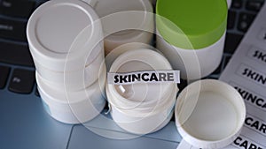 Empty packaging containers for skincare products.