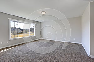 Empty pale grey room interior with carpet floor.