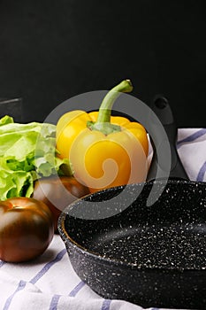 Empty pan with ingredients. cast iron pan and vegetables on light culinary background