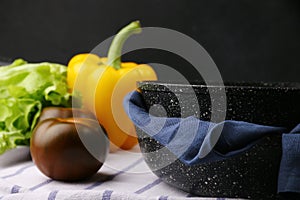 Empty pan with ingredients. cast iron pan and vegetables on light culinary background