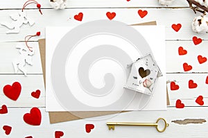 Empty papaer cards decorated with heart, miniature house with heart, golden key on wooden background, Valentine`s Day