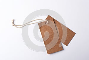empty paper brown tag on the rope, white background