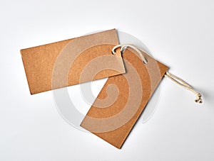empty paper brown tag on the rope, white background