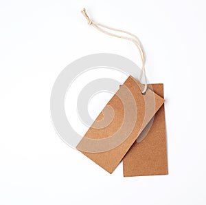 empty paper brown tag on the rope, white background