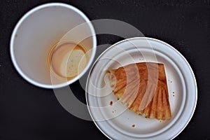 Empty coffee cup and plate overhead view
