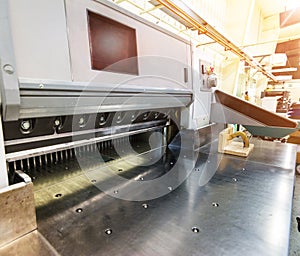 Empty paper guillotine in a modern offset printing facility