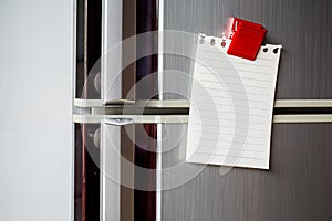 Empty paper sheet on refrigerator door with magnetic clip paper note for add text message