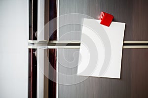 Empty paper sheet on refrigerator door with magnetic clip paper note for add text message