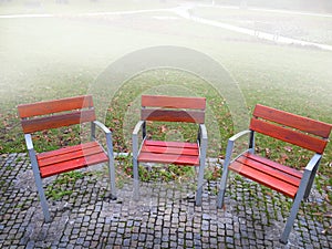 Empty park banches and seats in November.