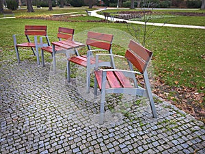 Empty park banches and seats in November.
