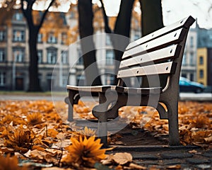 an empty park bench surrounded by autumn leaves