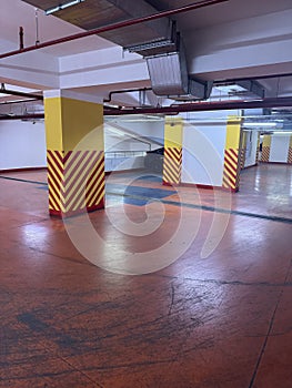 Empty parking garage with striped columns