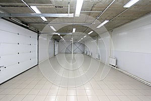 Empty Parking garage underground interior with blank billboard