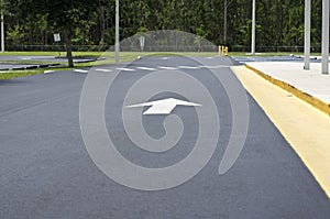 Empty parking lot with arrow and crosswalk