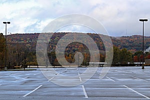 Empty parking lot with fall background