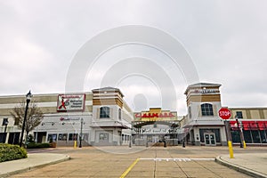 Empty parking lot in front of a Cinemark Movie Theater and an Applebee`s Restaurant during the COVID-19 shutdown.