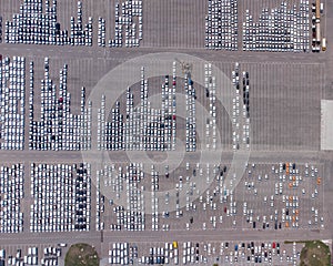 Empty parking lots, aerial view. A lot of cars in the parking lot. Colorful moody drone shoot.