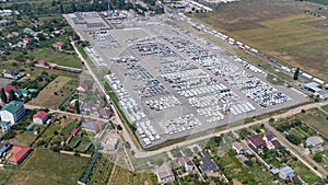 Empty parking lots, aerial view. A lot of cars in the parking lot. Colorful moody drone shoot.