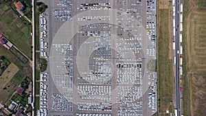 Empty parking lots, aerial view. A lot of cars in the parking lot. Colorful moody drone shoot.