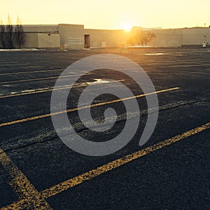 Empty parking near a shopping mall at sunset