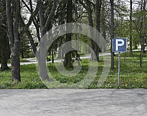 Empty parking and parking sign, deadpan photography