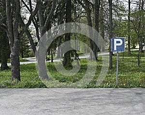 Empty parking and parking sign, deadpan photography photo