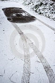 Empty parking space. There were traces of the wheels on the snow and after a blizzard you can determine where the car was