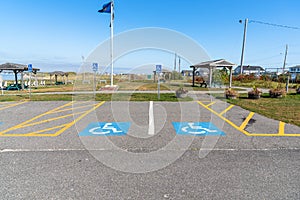 Empty parking spaces for disabled in a public park on a sunny day