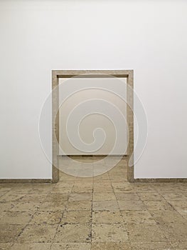 Empty passage in the middle of a white wall