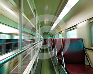 Empty passenger train car with motion blur