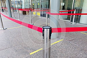 Empty paths bounded by a red ribbon. Tape security at the airport