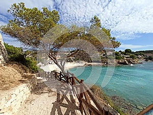Empty pathway fenced with wooden railings lead to Benissa beach. Spain photo