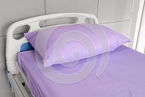 Empty patient bed in hospital room. Bed is for patient admitted to hospital photo