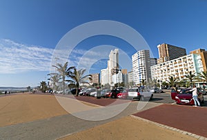 Empty Paved Promenade against Coastal Beachfront City Skyline