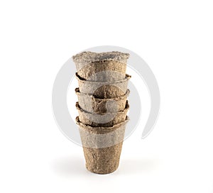 empty peat cups on a white background