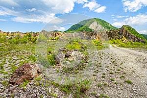 Empty rural road through mountain cliffs photo