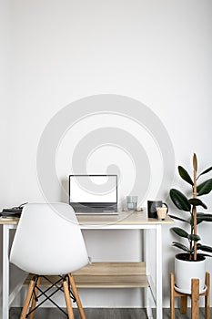 Empty on people. white bedroom with desk office space interior design With Mockup laptop supplies white screen tables and chairs