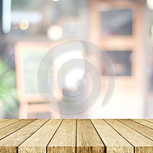 Empty perspective wood, tabletop, over blur restaurant with bokeh light background, food and product display montage background