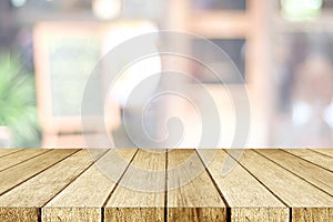 Empty perspective wood, tabletop, over blur restaurant with bokeh light background, food and product display montage background