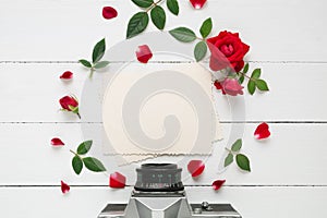 Empty photo frame for inside, retro camera and rose flowers