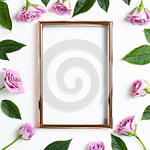 Empty photo frame with pink rose flowers on white background