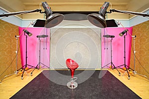 Empty photo studio with lighting equipment