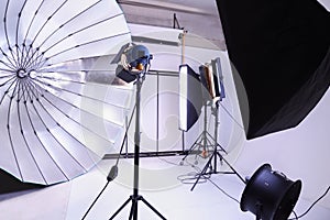 Empty photo studio with modern lighting equipment