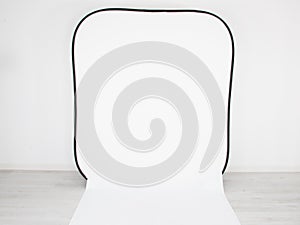 Empty photo studio for template mock up with backdrop stand white paper backdrop