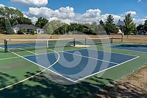 Empty Pickleball court blue and green recreational sport at an outdoor park