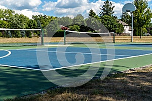 Empty Pickleball court blue and green recreational sport at an outdoor park