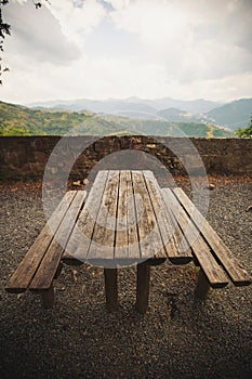 Empty picnic table and chairs in the mountains on a beautiful viewpoint. picnic table at the european mountains.
