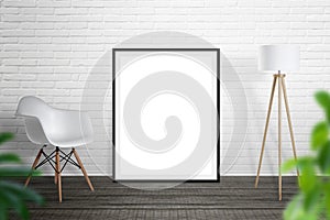 Empty picture frame leaned on brick wall