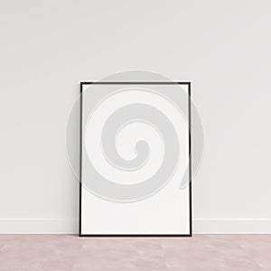 Empty picture frame on wooden floor leaning against wall. Blank poster frame standing on wooden floor. Blank poster frame mockup.