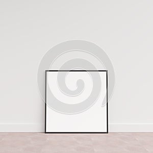 Empty picture frame on wooden floor leaning against wall. Blank poster frame standing on wooden floor. Blank poster frame mockup.